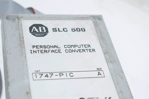 Close-up of 1747-PIC Interface Converter 24 V DC Personal Computer Interface Card for PLC Systems, SLC 500 label visible.