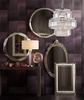 Modern Crystal Raindrop Pendant Chandelier With LED Ceiling Light, 13 in diameter, hanging in an elegant room setting.