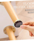 Round self adhesive glide pad under furniture leg protecting hardwood floor while being applied, part of Move Heavy Couches Like Butter With These Round Self Adhesive Glide Pads No Sweat Chair Leg Shields That Safeguard Your Hardwood Floors And Quiet Down Every Scraping Noise While You Push Tables Or Dressers Anywhere.