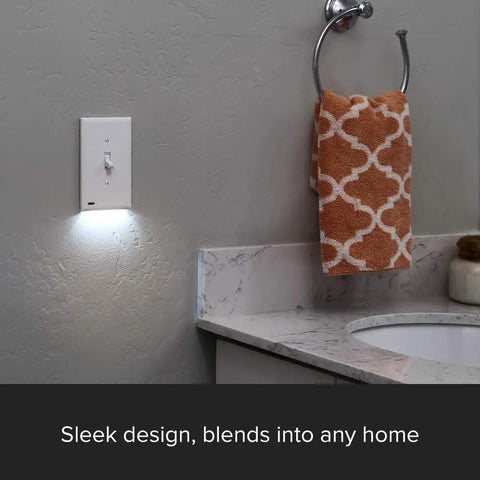 SwitchLight LED Night Light For Single Pole Switches With Auto On Off Sensor in white bathroom setting, wall mounted