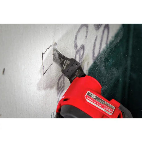 Heavy Duty Carbide Tipped Metal Cutting Blades With Ultra Sharp Edges cutting into drywall with a power tool.