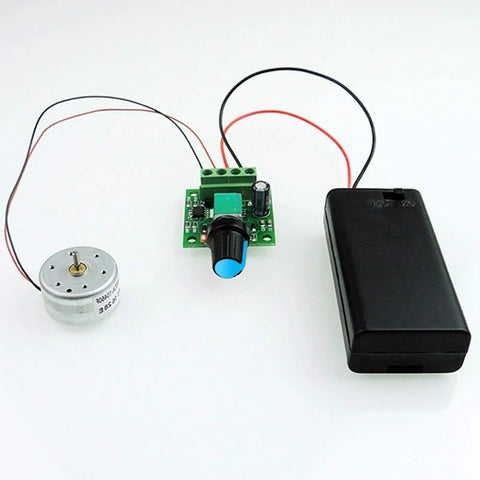 Low Voltage PWM DC Motor Speed Controller 1.8V To 12V 2A 24W Adjustable Driver Switch displayed with DC motor and battery holder