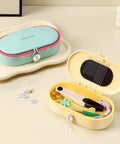 Grab And Go Travel Sewing Kit With Round Case Emergency Repair Gear With Needles Thread Scissors Thimble open in yellow.
