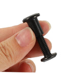 Tough As Nails M6x25 Stainless Steel Binding Post Screws For Leather Bags And Saddle Work shown in hand, detail of black socket cap.
