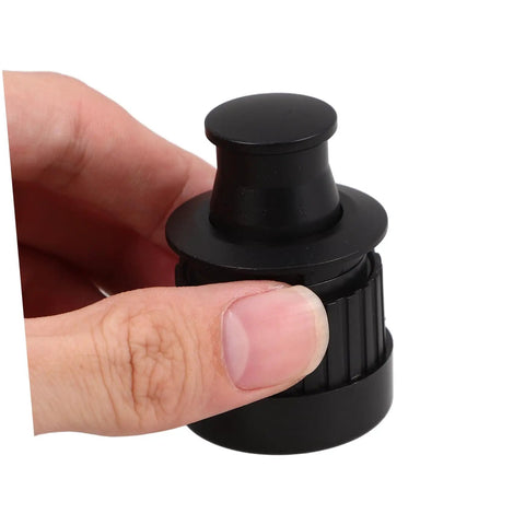 Close-up of a black zinc alloy Hidden Pop Up Drawer Pull Handle For Cabinets And Doors Finger Pull Cabinet Handle in hand.