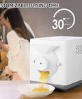 Top Shelf 1600w Electric Coffee Bean Roaster For Home With Auto 360 Degree Stirring And Adjustable Heat Dial dispensing roasted beans.
