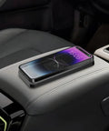 Hella Fast 15W Wireless Car Charging Pad For Chevrolet Blazer EV 2023 Through 2025 with a smartphone charging on a center console.