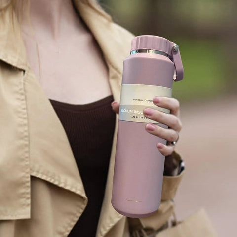 Person holding an Insulated Leakproof Stainless Steel Water Bottle 24 Oz Vacuum Hydration Flask For Sports Hiking Travel And Daily Use