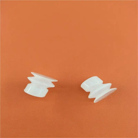 Two white Built Like A Tank Double Industrial Vacuum Suction Cups With Automatic Chuck for robotic manipulators on orange background.