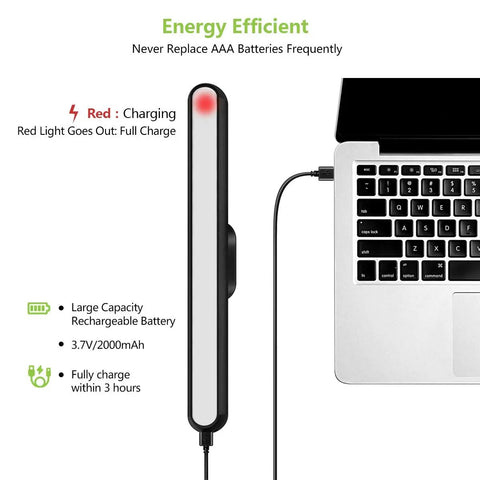 Dimmable Wall Reading Light With Magnetic Mount charging via USB-C cable next to laptop, red light indicates charging status.
