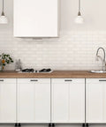 Modern kitchen with 12 Pack 4 Inch Square Cabinet Handles Matte Black Pulls on white cupboards and drawers, sleek design