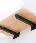 Rock Solid Wall Mounted Shelf Brackets Pack Of Two Heavy Duty Metal Supports Black Steel Finish 12 Inch Arms holding a wood shelf.