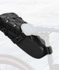 Rainproof 5.8L Bike Saddle Bag With Expandable Storage And Reflective Straps, mounted on a bike seat, polyester nylon material