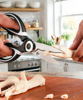Stainless Steel Kitchen Shears Heavy Duty Utility All Purpose Ultra Sharp Scissors For Food Prep And Cooking Kitchen Shears For Cutting Meat Herbs Poultry And Various Kitchen Tasks cutting raw poultry on a kitchen counter