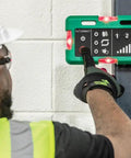 Operator using the Three Piece Wireless Cable Pulling Signal System With Magnets And Bright LED Visuals For Noise Free Jobsite Comms.