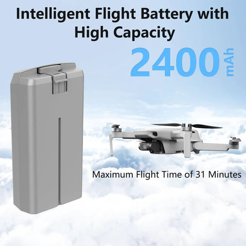 Two Pack 2400mAh 7.7V Battery Set With Display Charging Hub For DJI Mini 4K Mini 2 Mini 2 SE Mini SE next to drone in sky.