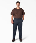 Original Straight Leg Work Pants Built Solid As A Rock With The Roomy Big And Tall Fit Stone Cold Durable Polyester Cotton Blend Resists Wrinkles And Grease Spills Perfect For The Job Site Or Daily Office Hustle Navy Shade worn by a man with brown shirt standing.