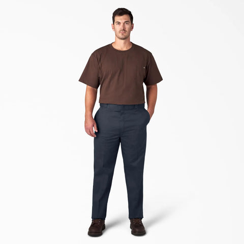 Original Straight Leg Work Pants Built Solid As A Rock With The Roomy Big And Tall Fit Stone Cold Durable Polyester Cotton Blend Resists Wrinkles And Grease Spills Perfect For The Job Site Or Daily Office Hustle Navy Shade worn by a man with brown shirt standing.