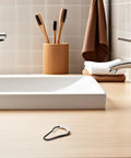 20 Pack Plastic Shower Curtain Hooks With Beaded Design on a bathroom counter near sink