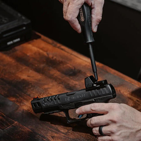 Using Space Saver Magnetic Screwdriver Set With Hollow Handle for gun maintenance, tool on pistol sight.