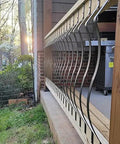 51 Pack 29.5 Inch Matte Black Iron Deck Balusters With Complete Hardware Kit For Exterior Stair Railing And Porch Safety Fences That Look Dope And Install Like A Breeze No Stress At All installed in a wooden railing.