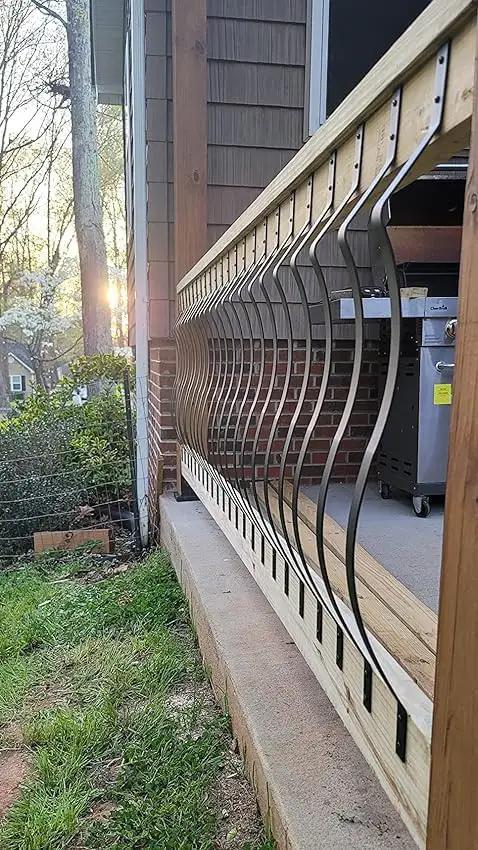 51 Pack 29.5 Inch Matte Black Iron Deck Balusters With Complete Hardware Kit For Exterior Stair Railing And Porch Safety Fences That Look Dope And Install Like A Breeze No Stress At All installed in a wooden railing.