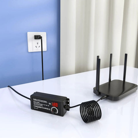 Universal AC DC Power Supply Adapter 72W Adjustable 3V To 24V Output With Voltage Display connected to a router
