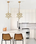 Moravian Star Brass Pendant Light, Dope Modern 14 Inch Ceiling Fixture With Clear Glass Shade in chic kitchen setting