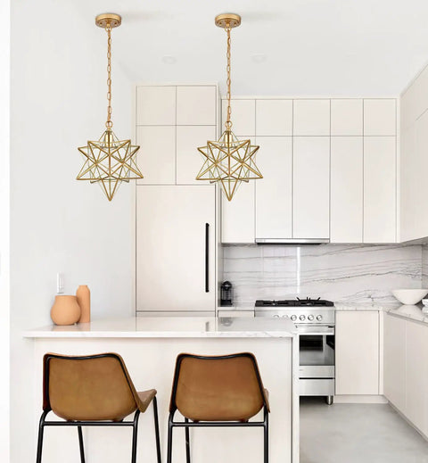 Moravian Star Brass Pendant Light, Dope Modern 14 Inch Ceiling Fixture With Clear Glass Shade in chic kitchen setting