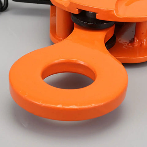 Close-up of orange swivel shackle on Heavy Duty 3 Ton Vertical Plate Lifting Clamps For Steel Weight Plates And Construction Sites.