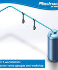 Leak Proof Shop And Garage Ready Air Piping Kit 3/4 Inch By 100 Foot HDPE Aluminum Air Line System For Air Compressors 200 PSI Easy To Install Flexible Piping ASTM F1282 Blue connected to a tank with three outlets in a workshop setup.