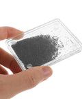 Close-up of hand holding a box from the Five Piece Magnetic Iron Powder And Iron Filings Set For Physics Classrooms And Science Labs