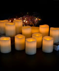 Flameless Battery Operated Pillar Candles Set Of 12 Real Wax Pillars With Dancing LED Flames 3 Inch By 4 Inch Ivory glowing in dark