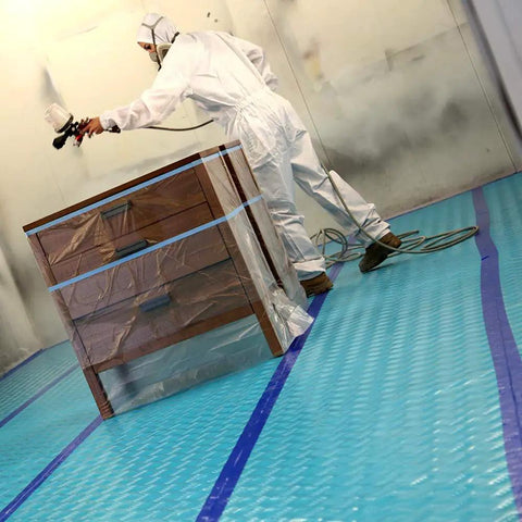 Painter using Aqua Shield Surface Protector 10 Mil 36 Inch By 100 Foot Heavy Duty Protective Film during painting project