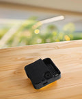 Pro Grade High Torque Quartz Movement for Large Watches Repair Kit, square black component resting on wood surface