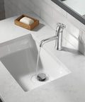 Trinsic Single Hole One Handle Chrome Bathroom Faucet With Diamond Seal Technology over a white sink