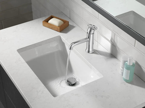Trinsic Single Hole One Handle Chrome Bathroom Faucet With Diamond Seal Technology over a white sink