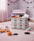 Dope Boo Halloween Basket For Kids With Pink Bow Glowing Ghost Canvas Trick Or Treat Tote filled with toys in a child’s room.