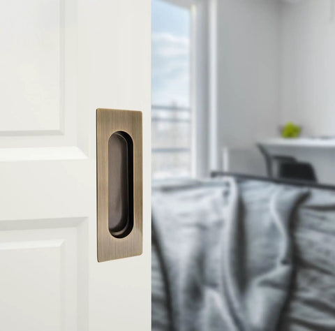 Slick And Hella Sturdy 4.7 Inch Rectangle Recessed Door Handles With Comfortable Oval Finger Flush Pulls For Barn And Sliding Pocket Doors Rust Resistant Stainless Steel Set Of Two on a white door.