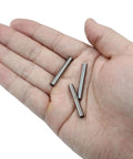 Hand holding 12 Pack 4mm By 30mm Dowel Pins Stainless Steel Shelf Support Pegs Built To Last Tough As Nails Metal Fasteners For Shelves