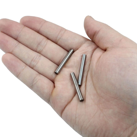 Hand holding 12 Pack 4mm By 30mm Dowel Pins Stainless Steel Shelf Support Pegs Built To Last Tough As Nails Metal Fasteners For Shelves
