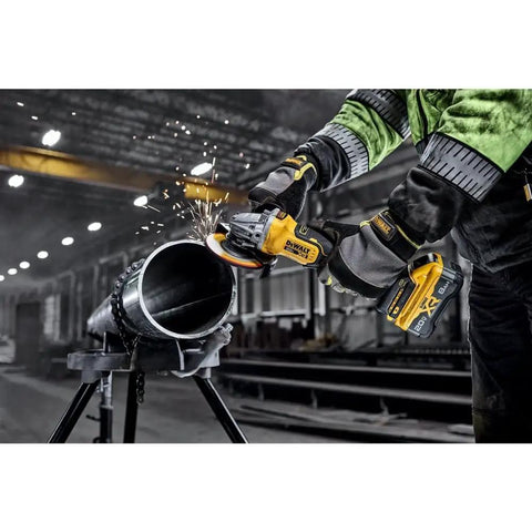 Heavy Duty 20V Brushless Cordless Angle Grinder Kit Featuring Smart Anti Rotation Safety And Portable Powerpack For Badass Metal Cutting And Grinding Tasks No Sweat in action cutting a metal pipe with sparks.