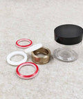 Seal assembly kit for HP waterjet cutter; brass ring, two red O-rings, two white O-rings, and spacers.