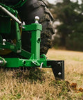 Dual Design Gooseneck Tractor Trailer Hitch With Hay Bale Spear Charcoal Frame Two Inch Receiver on grass field
