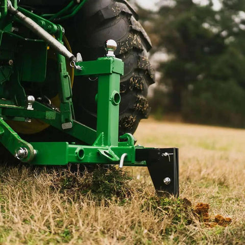 Dual Design Gooseneck Tractor Trailer Hitch With Hay Bale Spear Charcoal Frame Two Inch Receiver on grass field