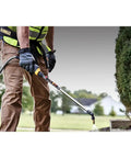 Person using 20V Max 4 Gallon Lithium Ion Cordless Backpack Sprayer Kit With 2Ah Battery for lawn care