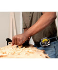 Person using No. 4 Smoothing Hand Plane With Extra Thick 1/8 Inch A2 Steel Iron, focusing on smoothing a wooden surface.