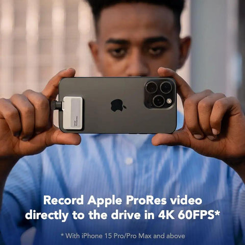 1TB Pro Go Portable SSD connected to iPhone 15 recording 4K ProRes video, showcasing its compatibility and speed for creators.