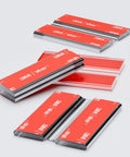 Heavy Duty Flex Piano Hinges Two Inch Wide Self Sticking No Glue Needed Low Profile Clear Acrylic Strip For Quick Fixups And Diy Setup Four Pack Solid laid out showing self-adhesive backing.