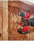 Compact 2-Tool Combo Kit with Brushless Impact Driver and Wrench Boss Gear for Demanding Jobs Epic Shop Essential M18 Cordless System in action drilling into wood.